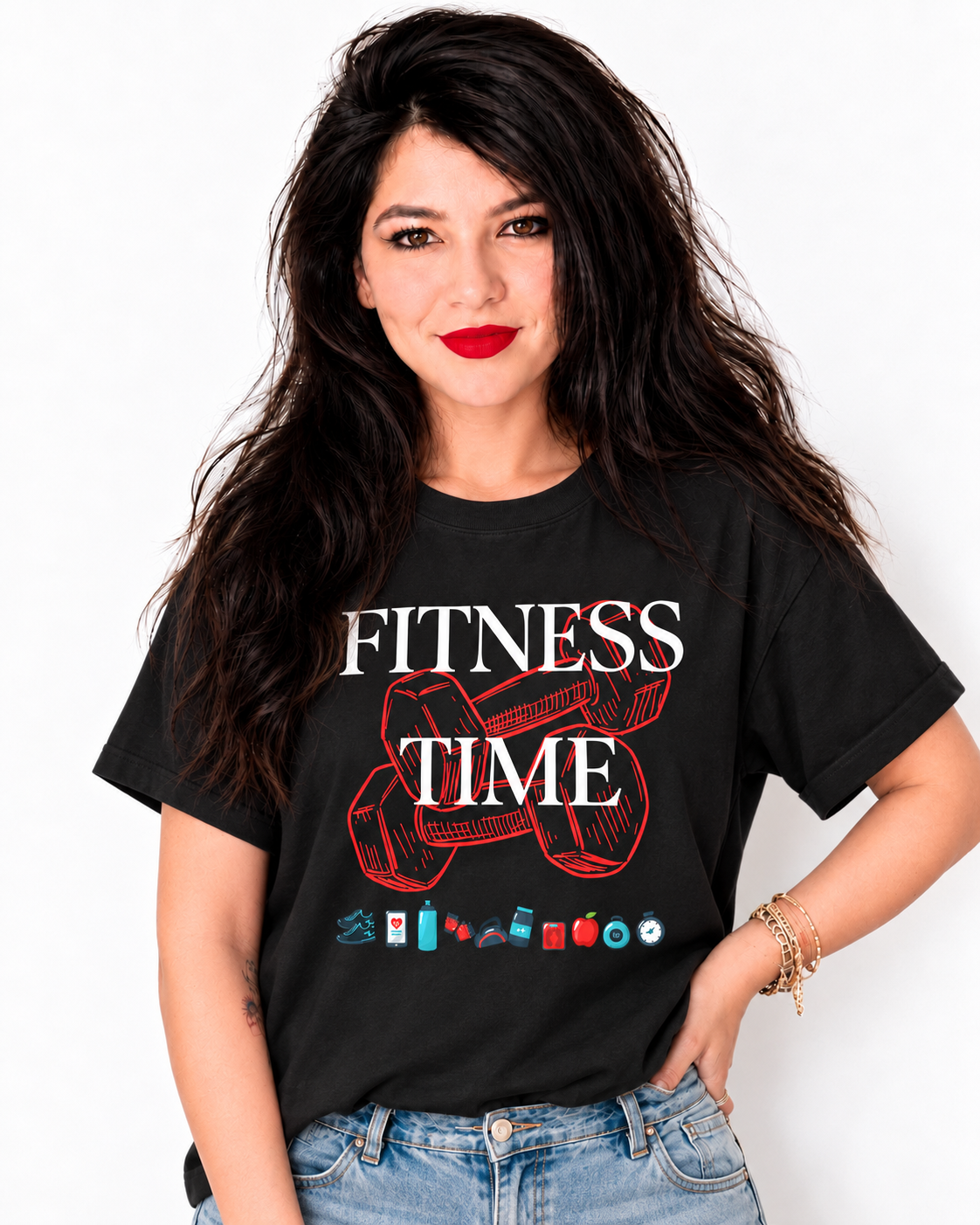 A woman with long dark hair and red lipstick wearing a black graphic t-shirt that reads 'FITNESS TIME' with a red dumbbell illustration and small fitness icons, paired with blue jeans against a plain white background.