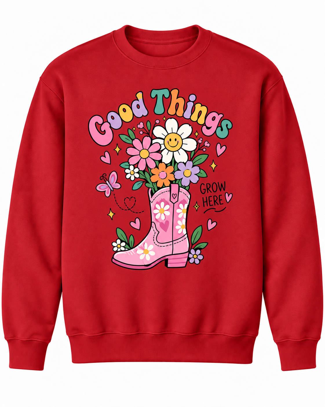 A red crewneck sweatshirt featuring a colorful graphic on the front with the text 'Good Things GROW HERE', a pink cowboy boot filled with flowers, and butterflies, shown on a plain white background.