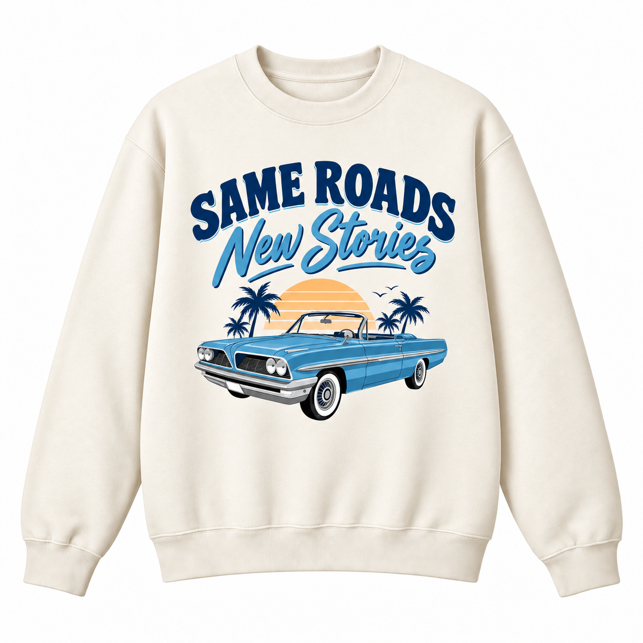 An off-white crewneck sweatshirt featuring a graphic print of a blue convertible car, palm trees, a sunset, and the text 'SAMEROADS New Stories' in blue and orange.