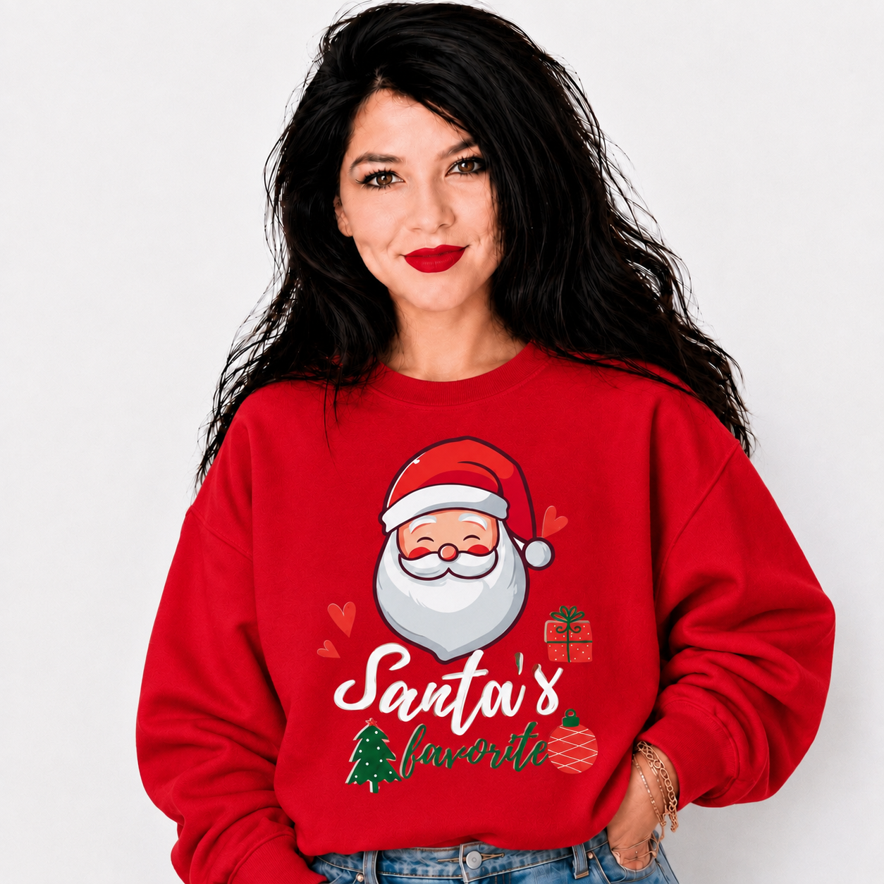 A woman with long black hair wearing a red crewneck sweatshirt with a graphic of Santa Claus and the text 'Santa's favorite'.